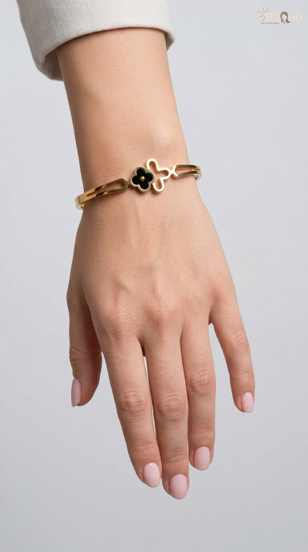 Elegant Gold Bracelet with Black Charm